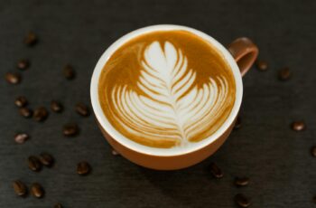 fresh brew of cafe latte in a brown mug