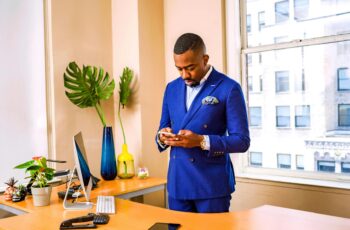 man standing while using phone
